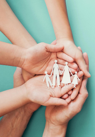 Hands caring for a family